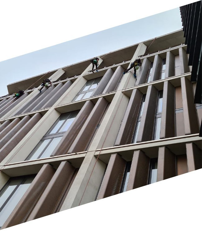Group of workers on side of building